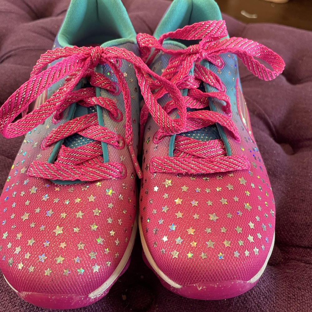 Little girl’s sparkly tennis shoes.